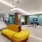 a room with a couch and tile floors