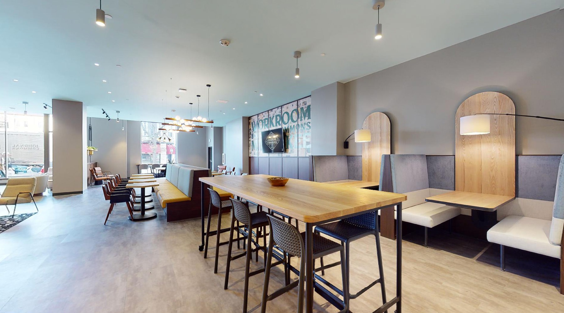 a large room with seating and chairs