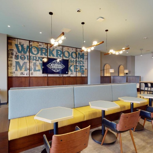 Find your perfect fit at Journal Commons a room with tables and chairs