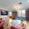 a lounge with a large tv and couches