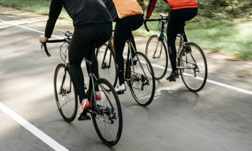 a group of people riding bikes