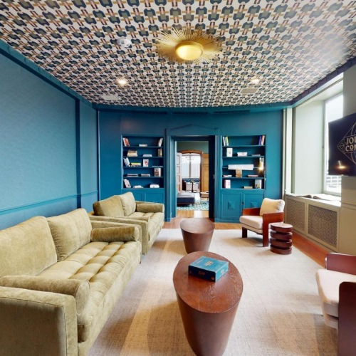 Settle into comfort at Journal Commons a room with a couch and chairs
